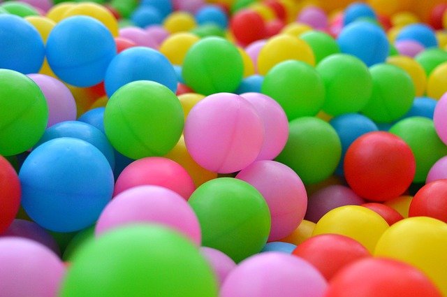 Lots of multi-coloured ping pong balls