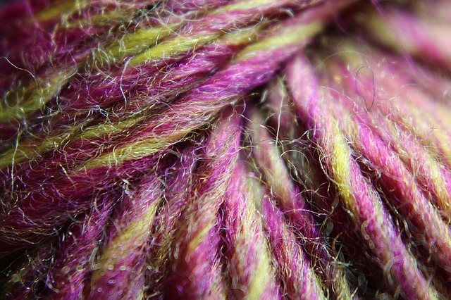 Ball of wool pink and yellow close up