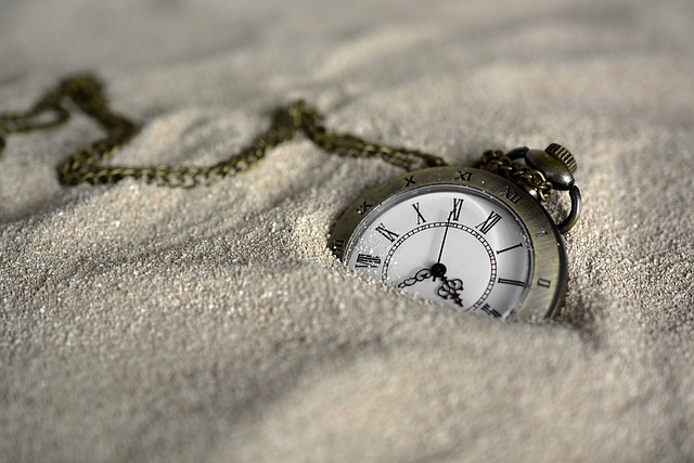A pocket watch in the sand