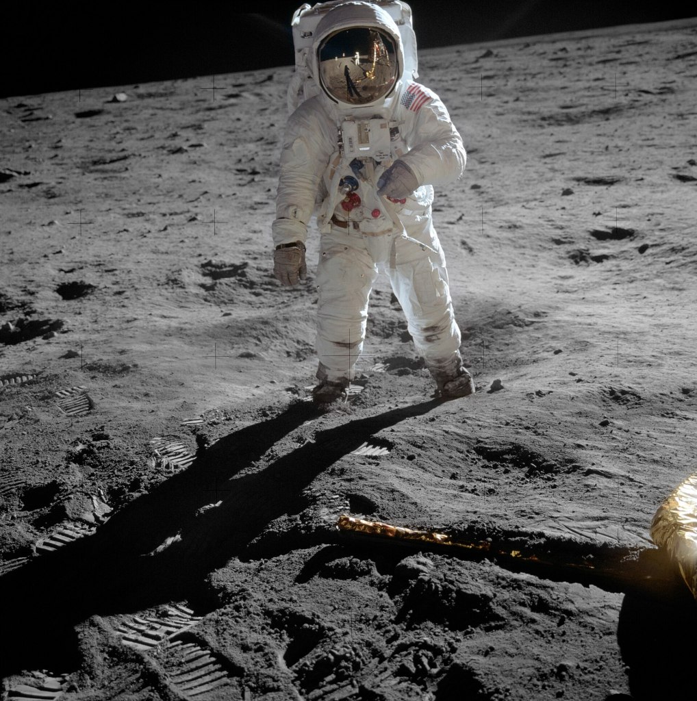Buzz Aldrin standing on the moon