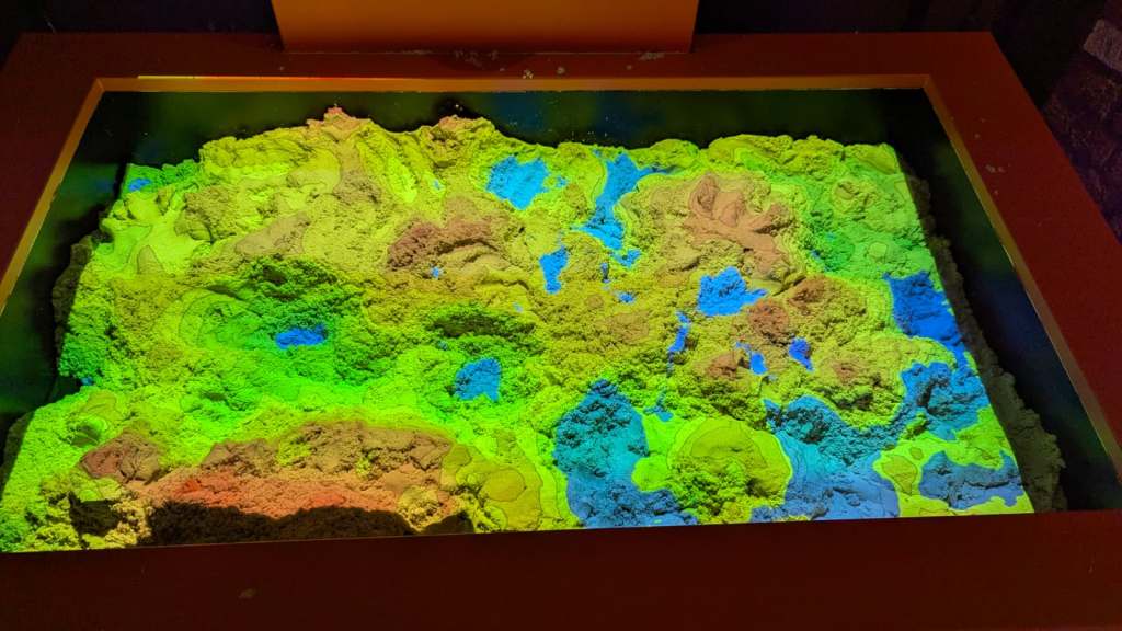 The projected image automatically adjusts (below) to the removal of the hill in red (above). 